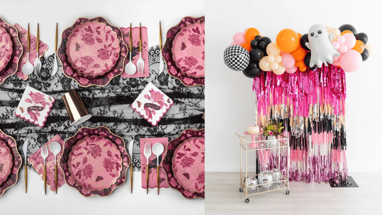 Pink floral table setting and ghost balloon decor with colorful streamers.