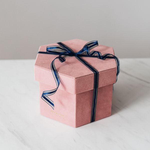 pink gift box with navy blue bow