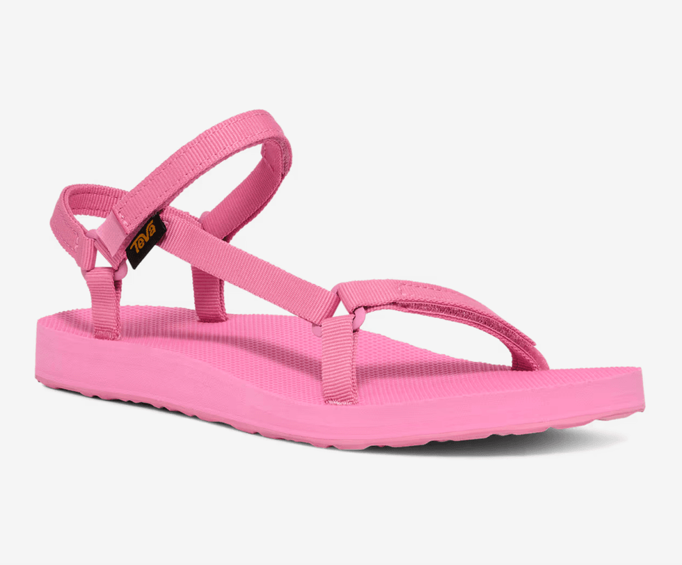 Pink sandal with adjustable straps and a flat sole.