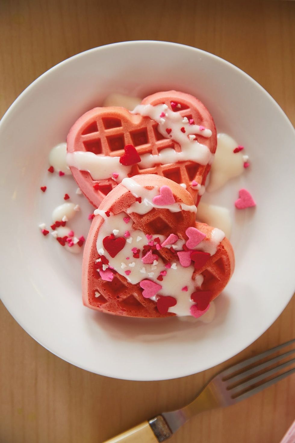 pink sprinkles on red velvet waffles