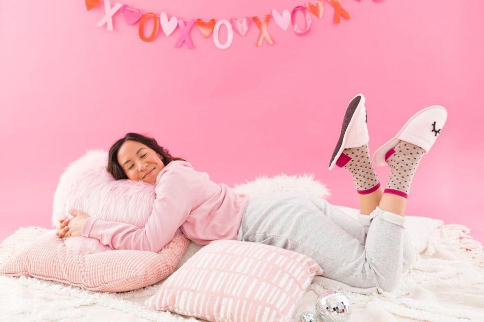 pink sweatshirt gray sweatpants polka dot socks and diy slippers
