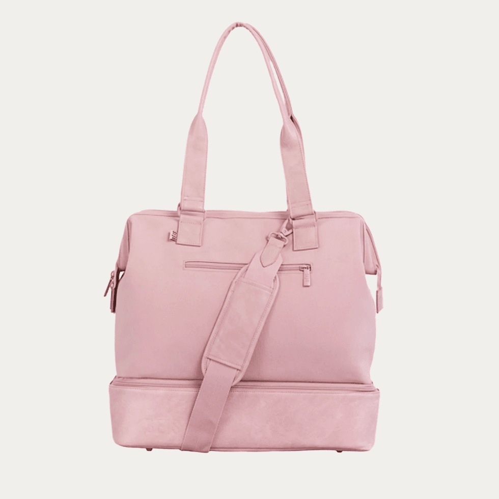 Pink tote bag with shoulder strap and zipper pocket.