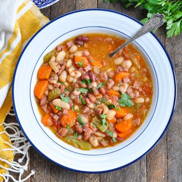 Plate of Slow-Cooked Bean Soup with cornbread on the side