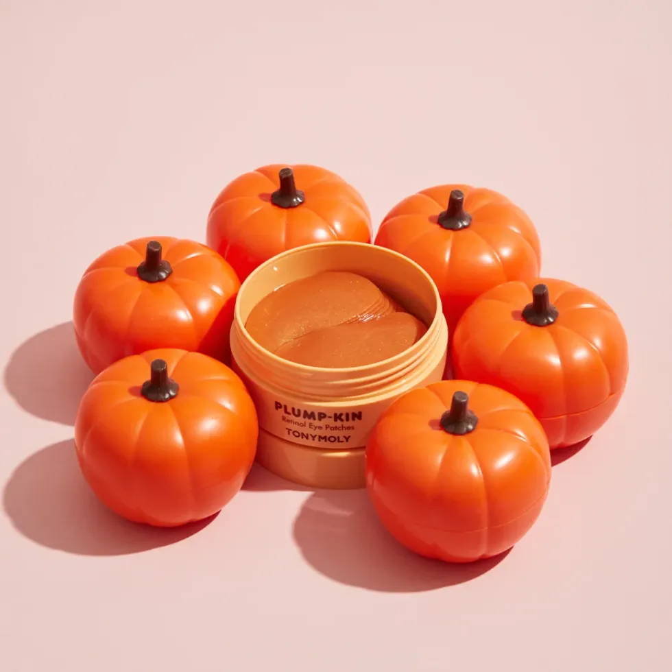 Plump-kin retinol eye patches are surrounded by plastic pumpkins