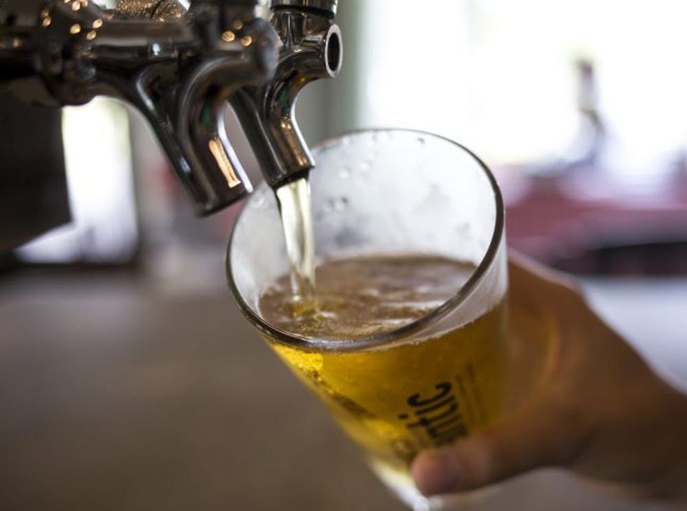 PORTLAND, ME - JULY 21: A bartender pours a pint of the local favorite, Miller Lite, at the Riverside Grill, located at the Riverside Grill, located at the city-owned Riverside golf course. (Photo by Brianna Soukup/Portland Press Herald via Getty Images)