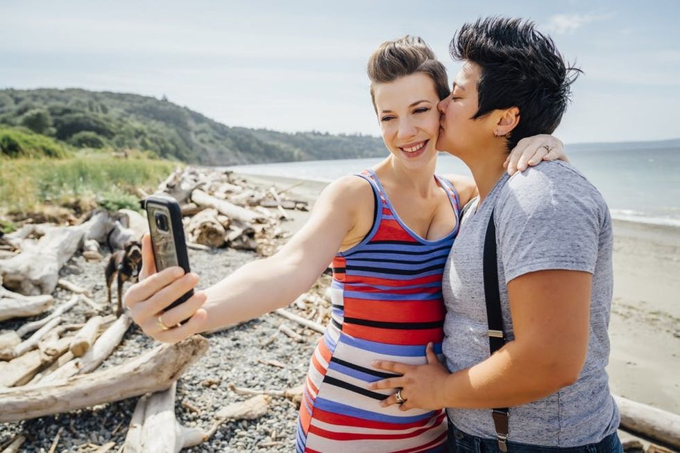 Pregnant couple on the beach