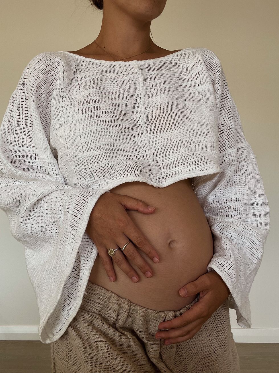 pregnant woman holding her stomach