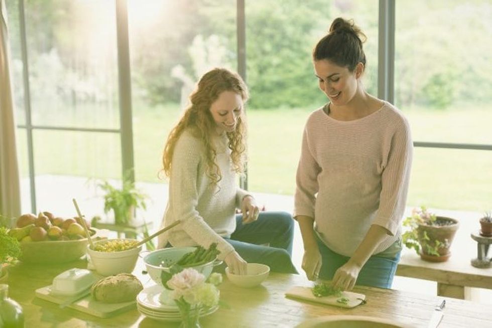 Pregnant women preparing food