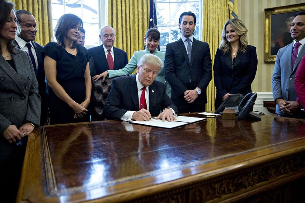 President Trump Signs Executive Order In Oval Office Of The White House