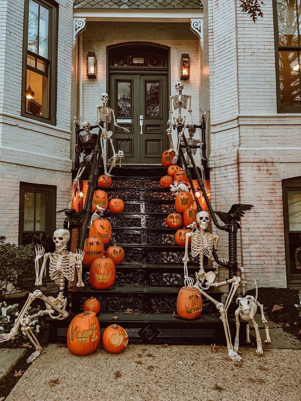 pumpkin and skeleton halloween decorations on stairs