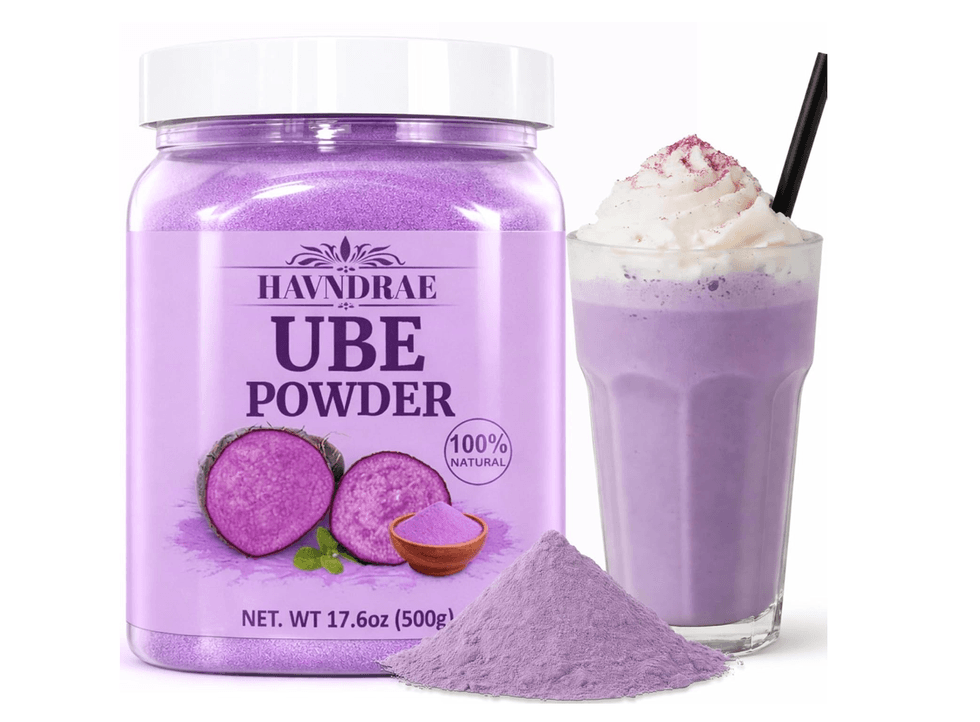 Purple Ube powder, glass with purple shake, and whipped cream.