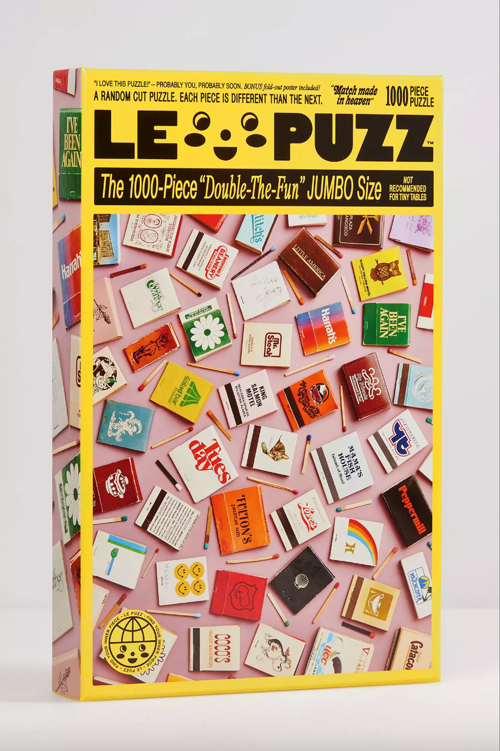 Puzzle box featuring vintage matchbooks and matches on a pink background.