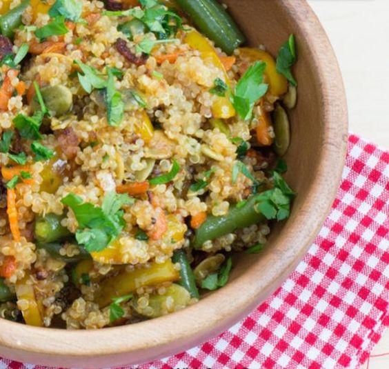 quinoa and vegetable meal on a red and white gingham tablecloth