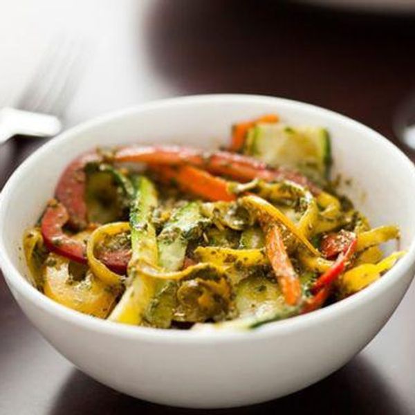 rainbow veggie pasta in a white bowl