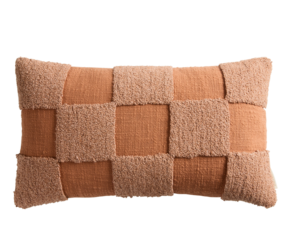 Rectangular pillow with a textured checkerboard pattern in shades of brown and tan.