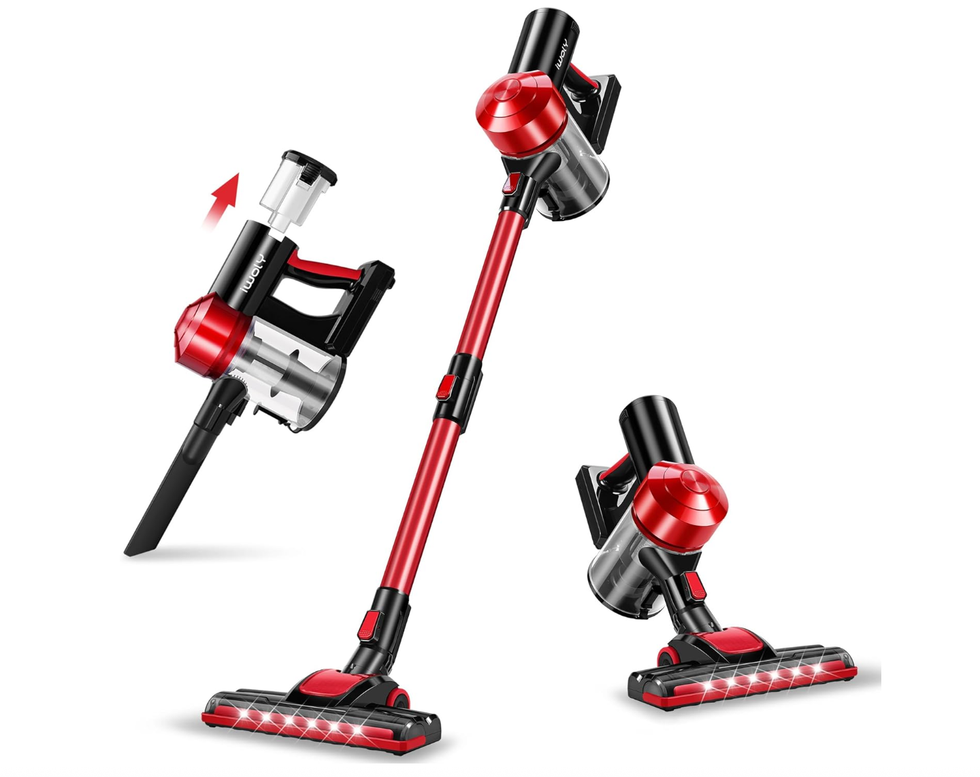 Red and black cordless stick vacuum cleaner with detachable parts.