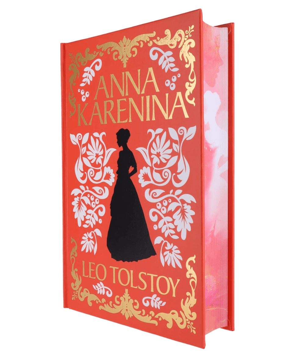 Red "Anna Karenina" book with gold lettering and floral design.