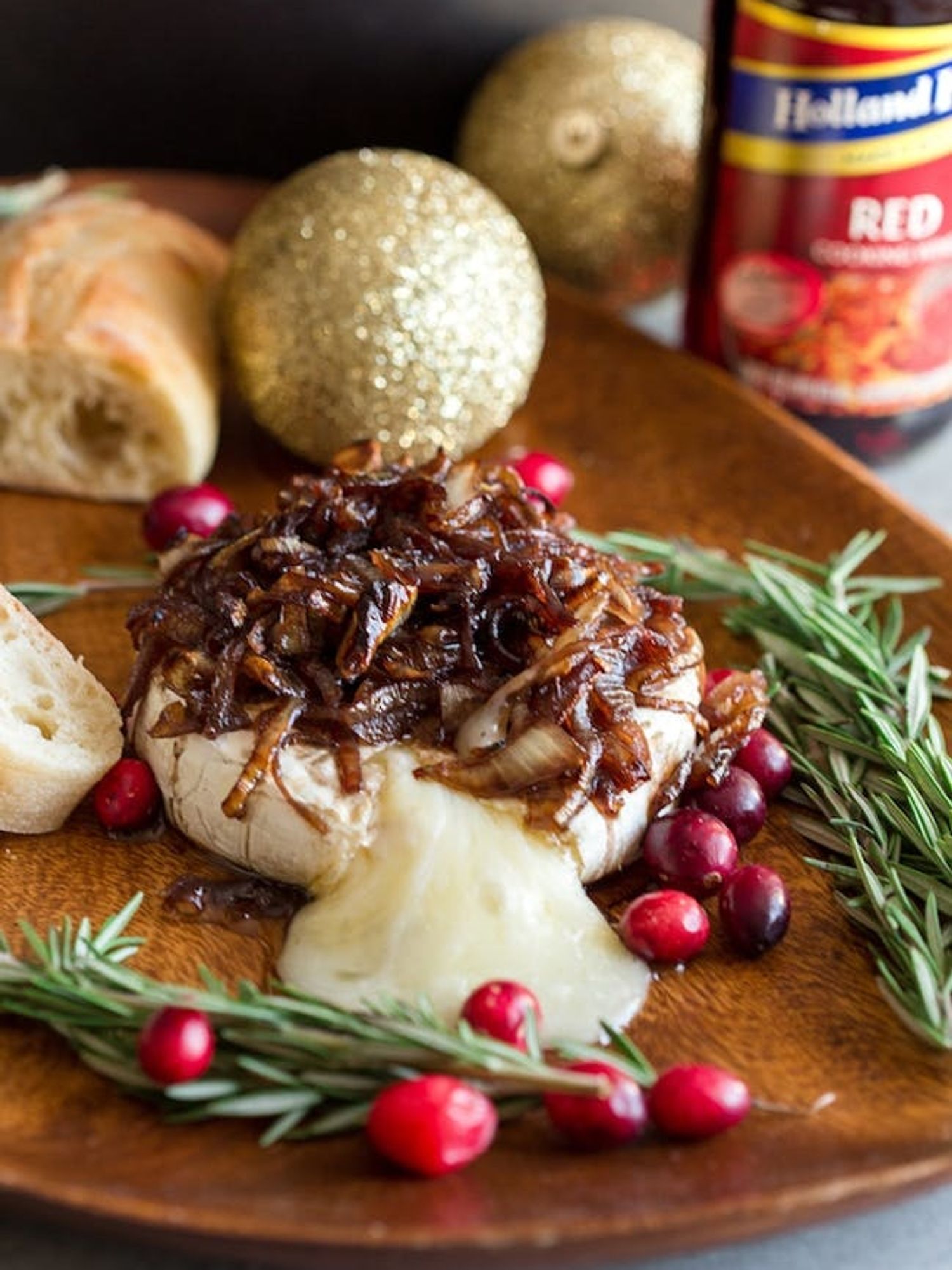 Red Cooking Wine Caramelized Onion Baked Brie decorated with some mistletoe