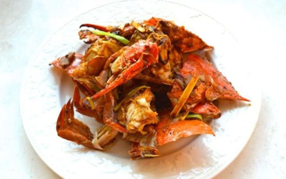 red crab dish on a white plate