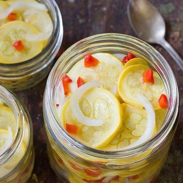 red pepper, onion, and yellow squash pickling in a clear jar