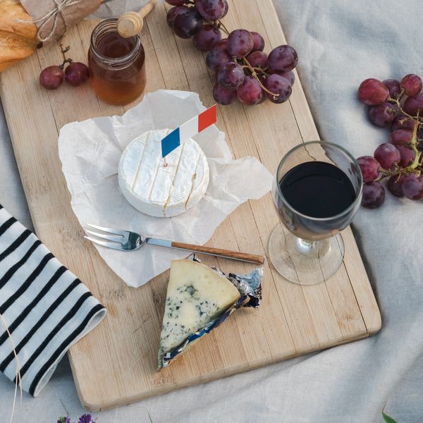 red wine on a board with cheese