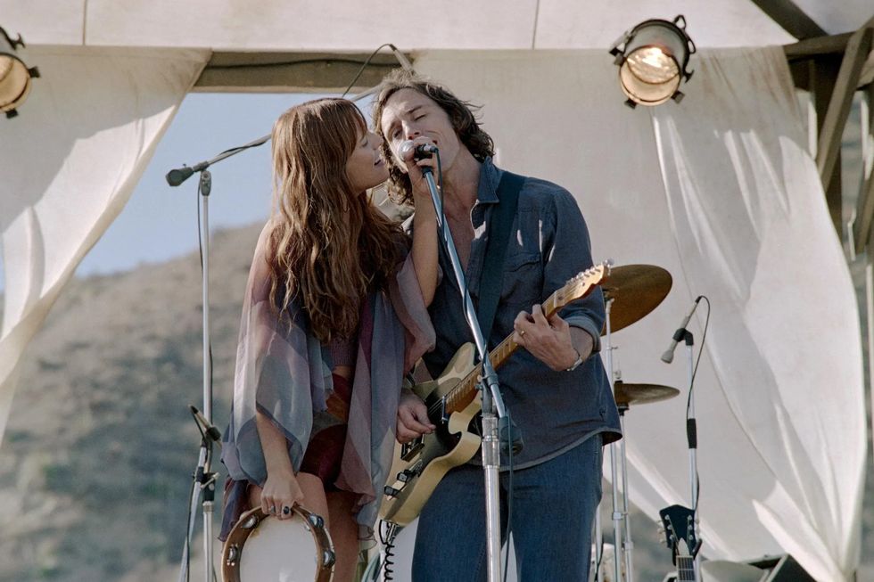 Riley Keough and sam claflin in daisy jones and the six