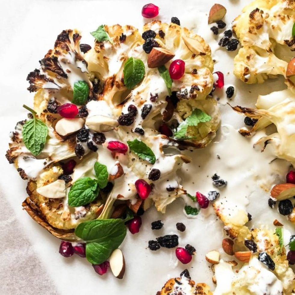 Roasted Cauliflower With Pomegranate, Almonds, and Tahini Dressing