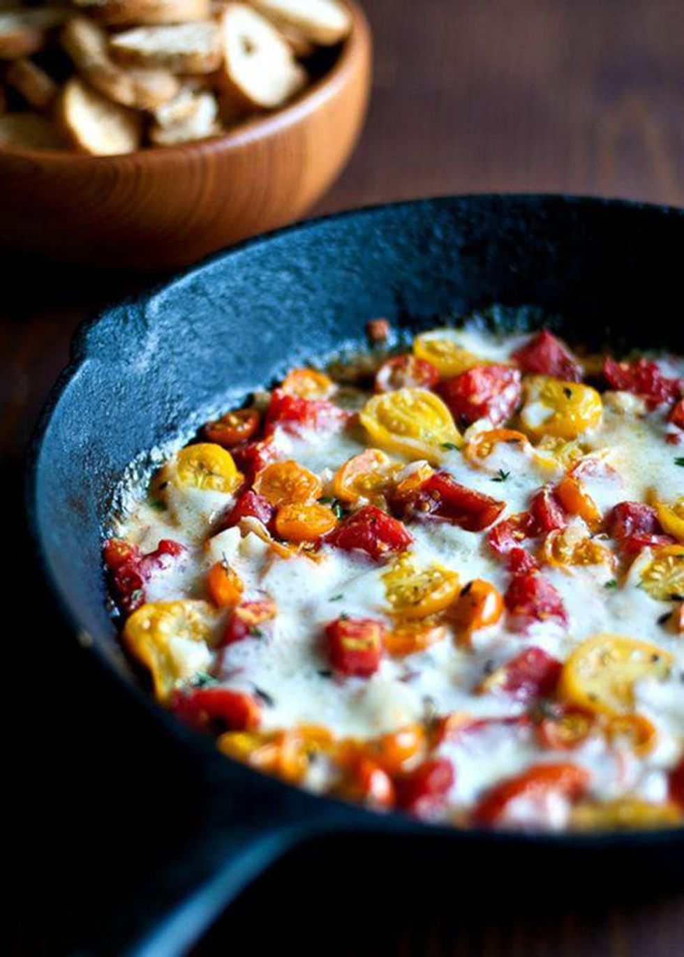Roasted Heirloom Tomatoes With Fontina and Thyme in black skillet