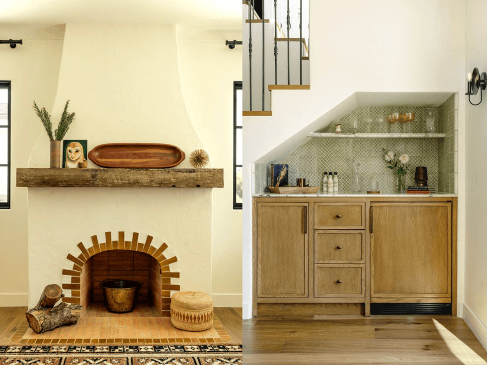 Rustic interior with a cozy fireplace and wood cabinet under a staircase.