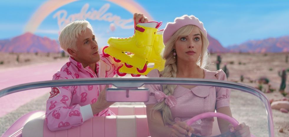 ryan gosling and margot robbie ride in barbie's pink car