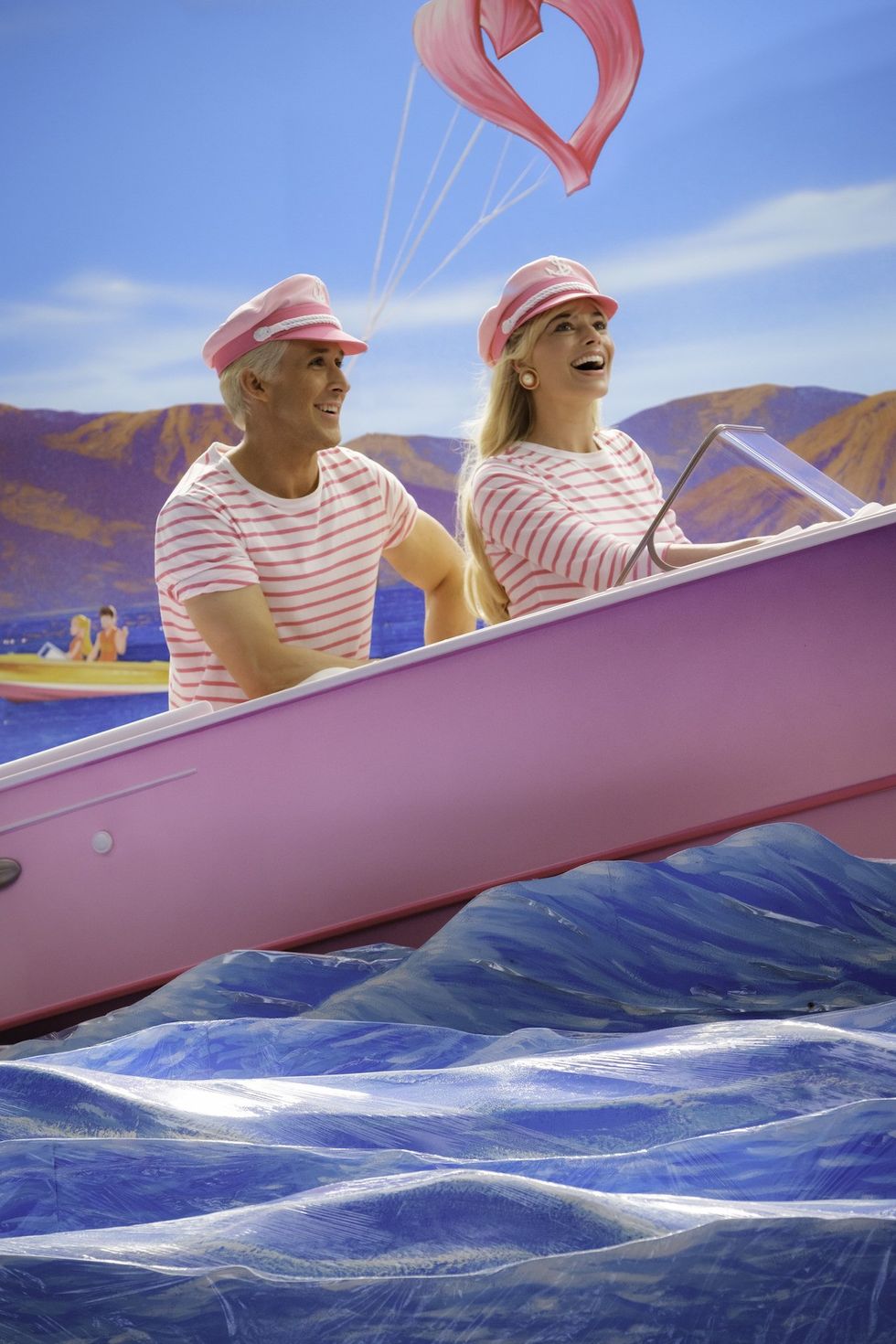 ryan gosling and margot robbie's ken and barbie sailing in the ocean