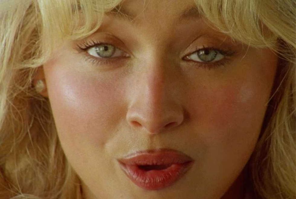 Sabrina Carpenter in the Manchild music video