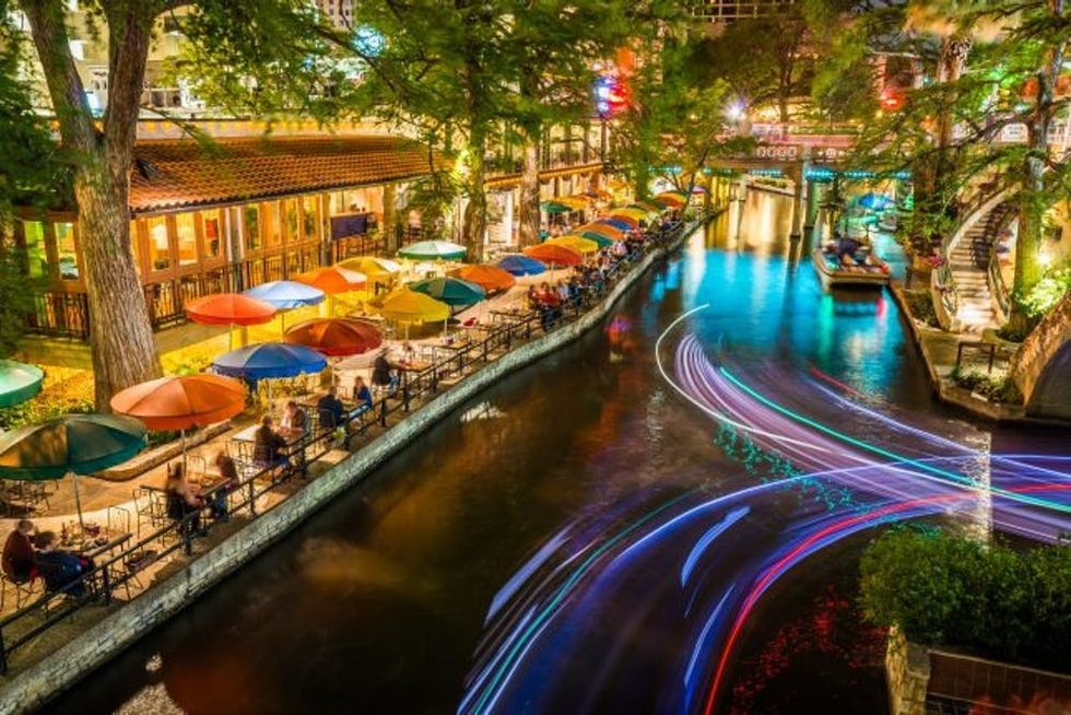 San Antonio Riverwalk, Texas, scenic river canal tourism umbrellas night