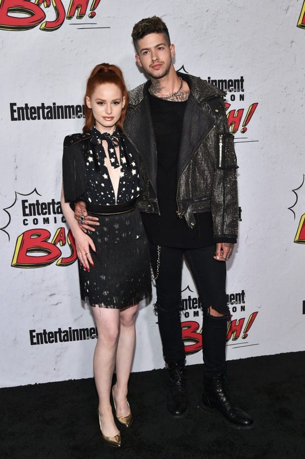 SAN DIEGO, CA - JULY 22: Madelaine Petsch (L) and Travis Mills at Entertainment Weekly's annual Comic-Con party in celebration of Comic-Con 2017 at Float at Hard Rock Hotel San Diego on July 22, 2017 in San Diego, California. (Photo by Mike Coppola/Getty Images for Entertainment Weekly)
