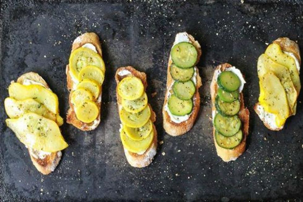 saut\u00e9ed summer squash on a baguette with olive oil, lemon and rosemary