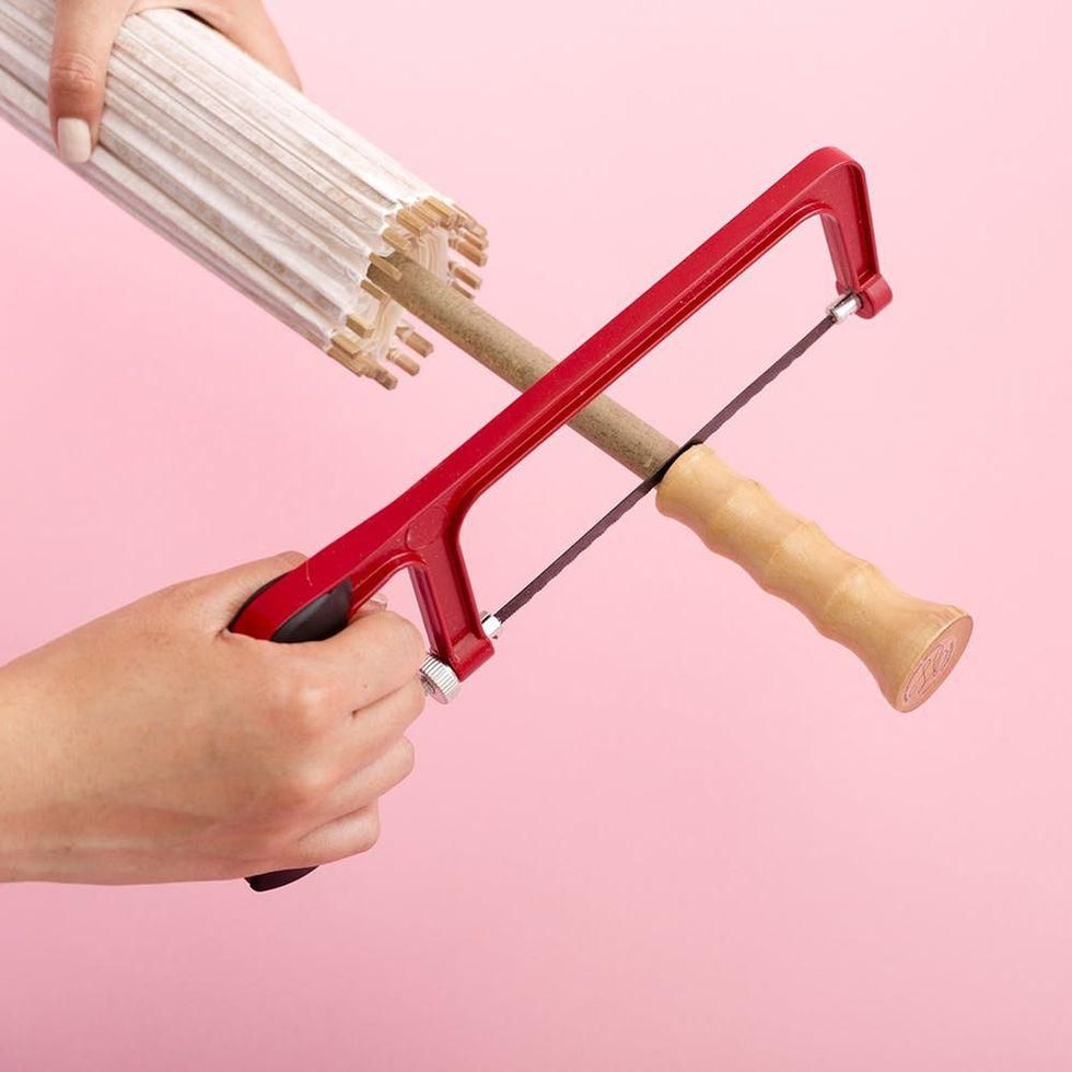 sawing off the umbrella handle