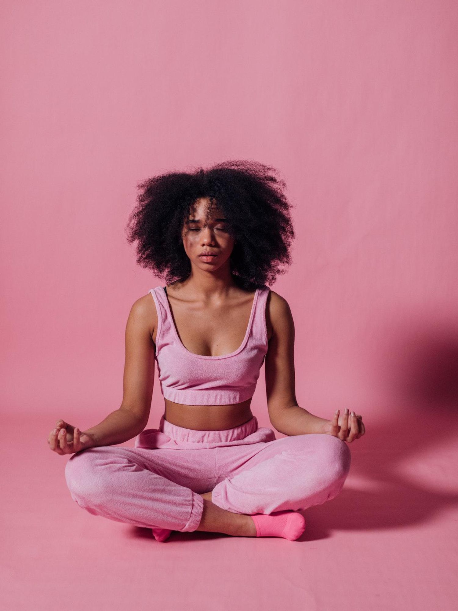 self care activities yoga in a pink room