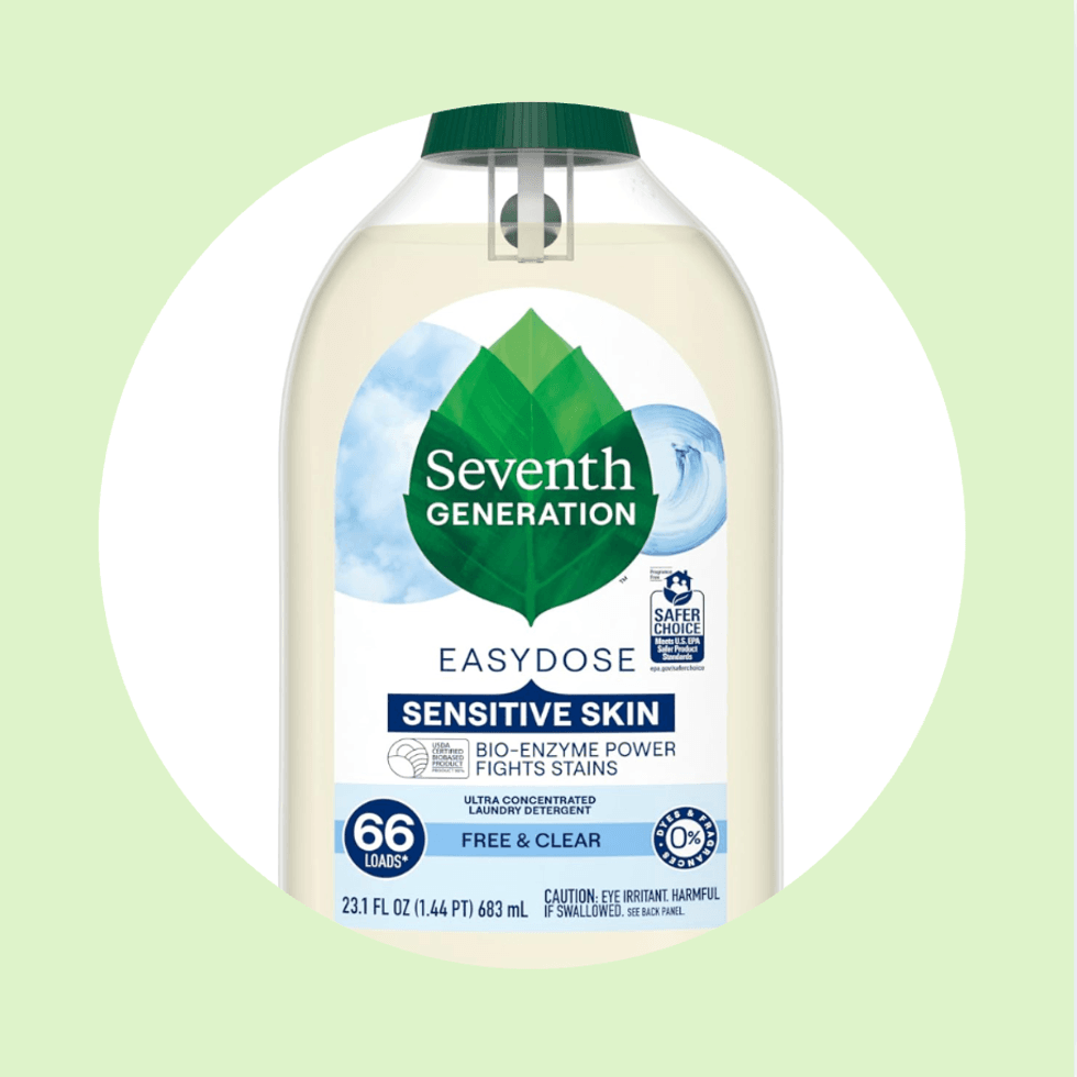 Seventh Generation Sensitive Skin Laundry Detergent Bottle on a green background.