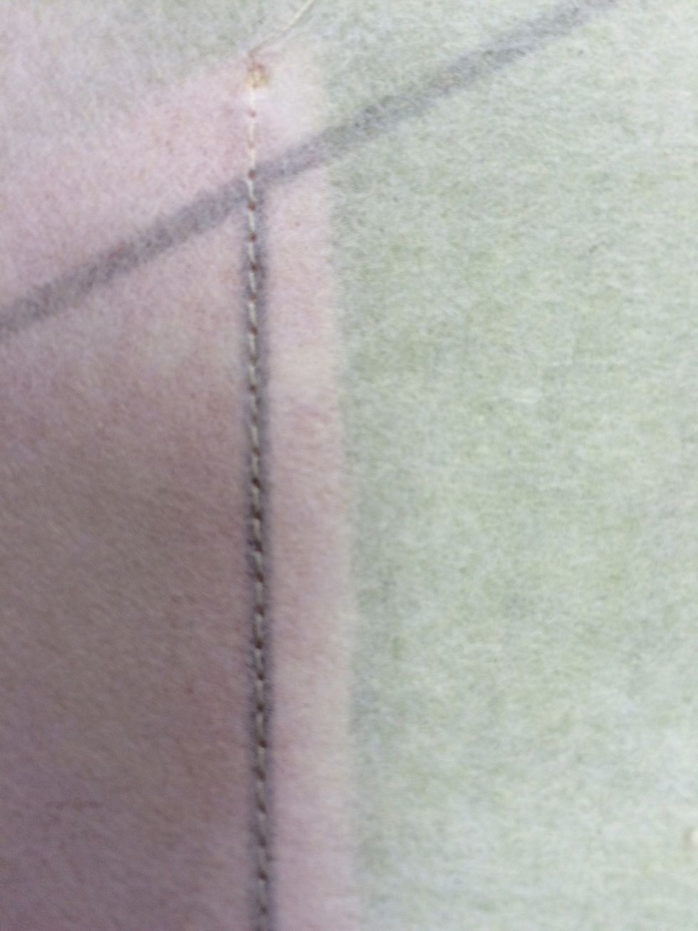 Sew into position along draw line