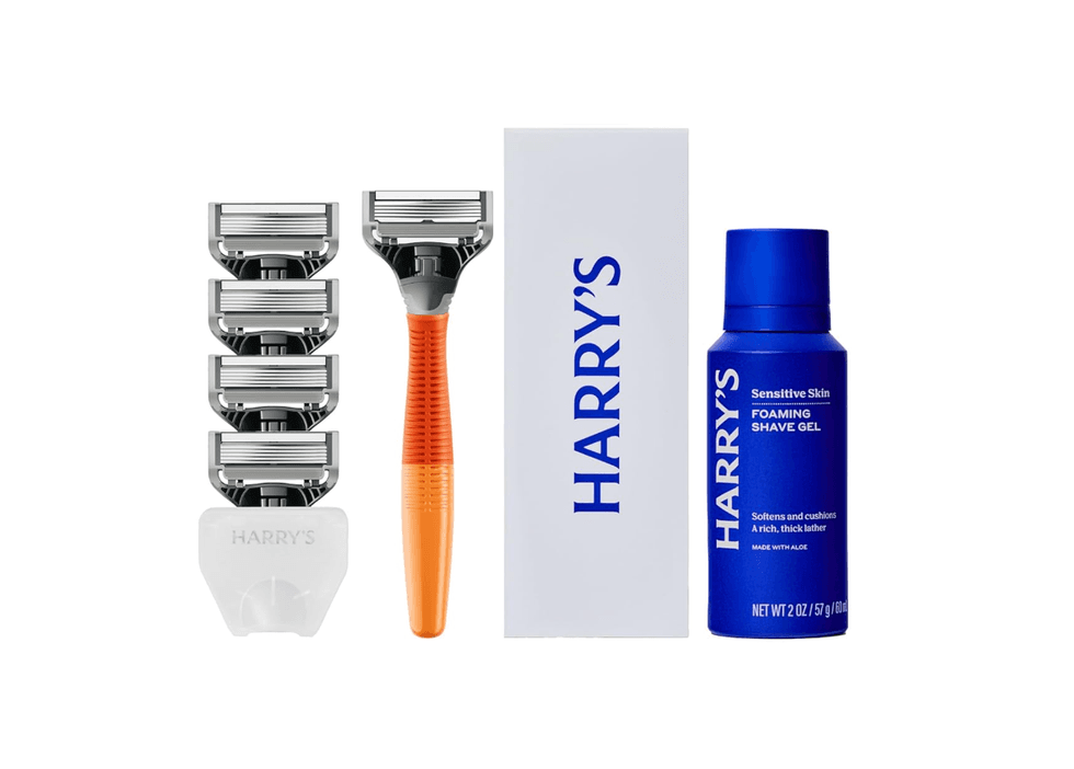 Shaving kit with razor, five blades, and blue foaming shave gel.