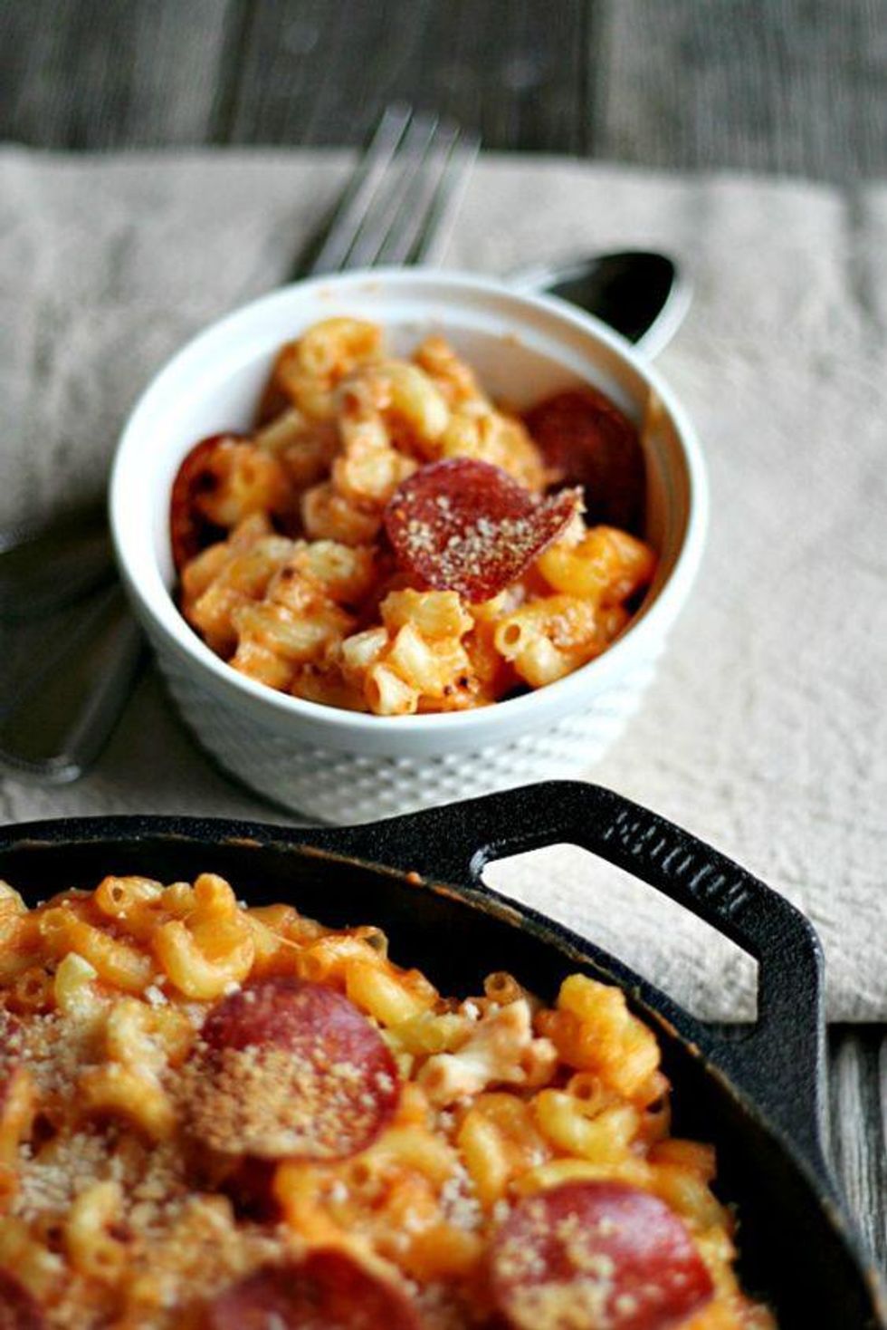 Skillet Mac and Cheese (Pizza Style) in a black skillet and a white bowl