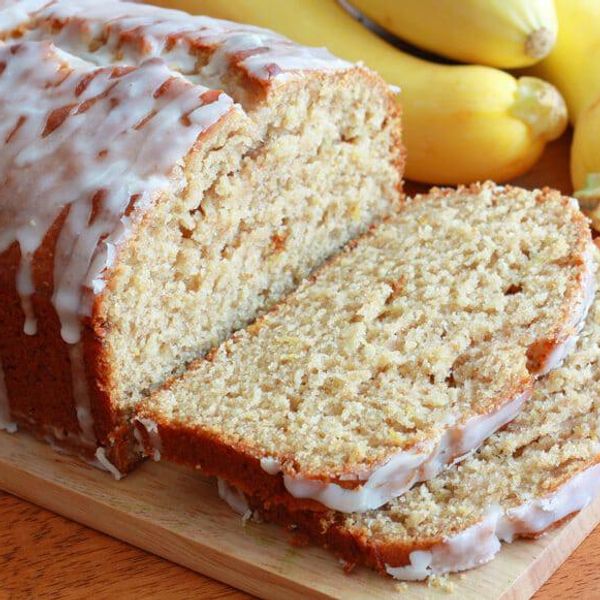 sliced bread with lemon glaze on a cutting board