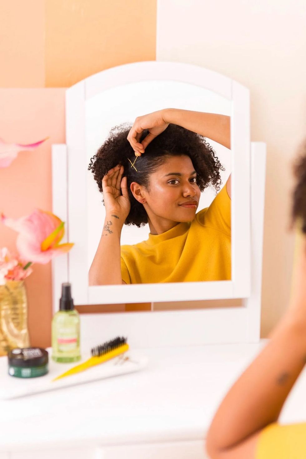 slicking back hair and clipping it