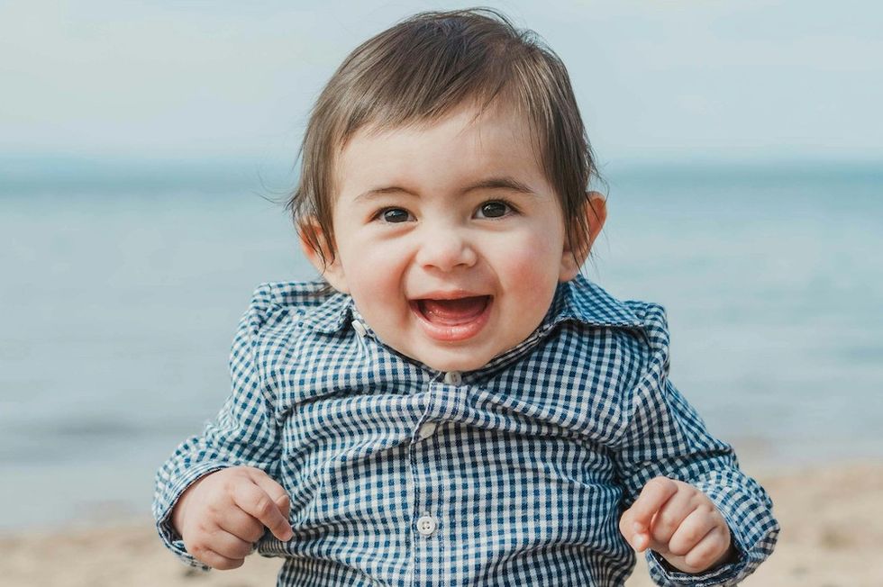 smiling baby at the beach