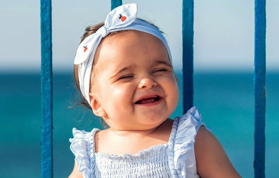 smiling baby girl in the sun