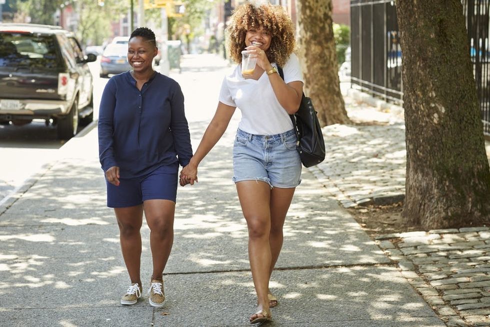 Smiling couple holding hands