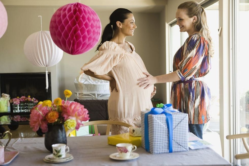 Smiling pregnant women at baby shower
