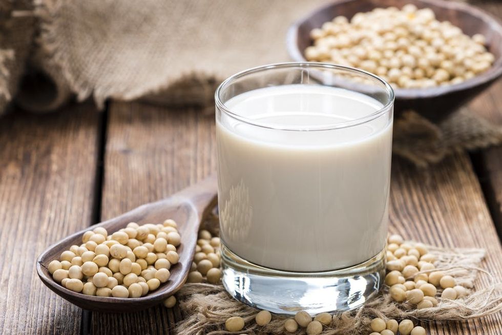 Soy milk and soy beans on a table