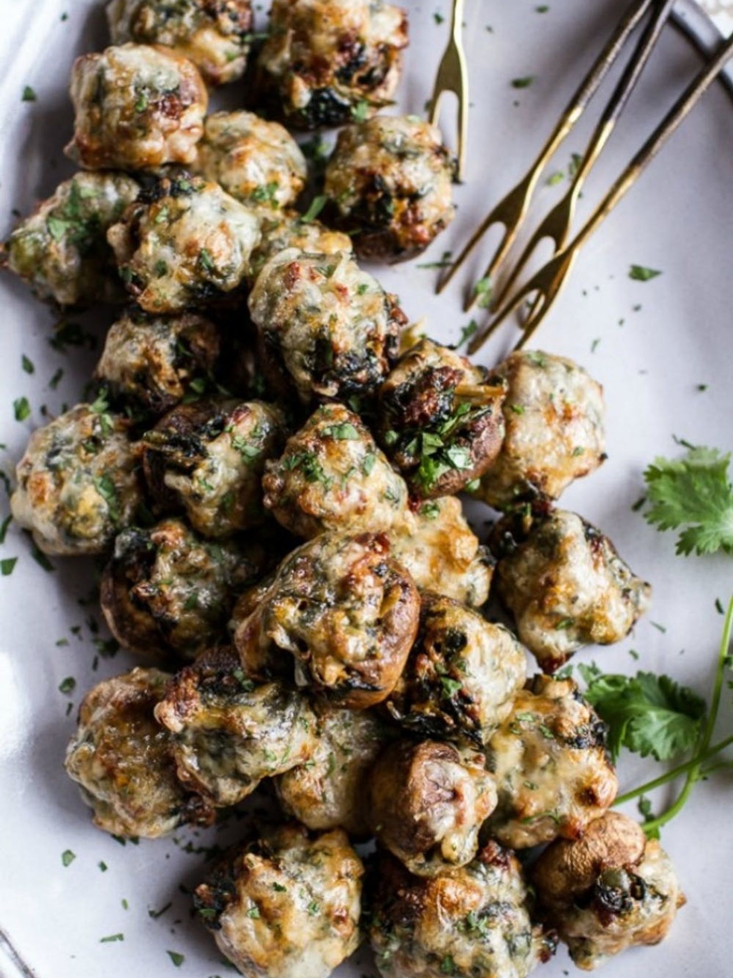 Spicy Fontina Spinach, Artichoke + Chorizo Stuffed Mushrooms