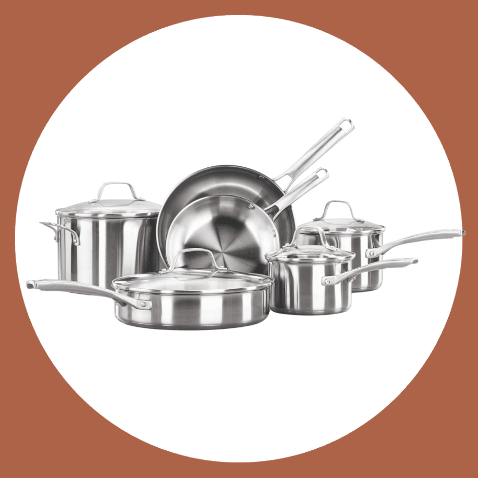 Stainless steel cookware set with pots and pans on a white background.